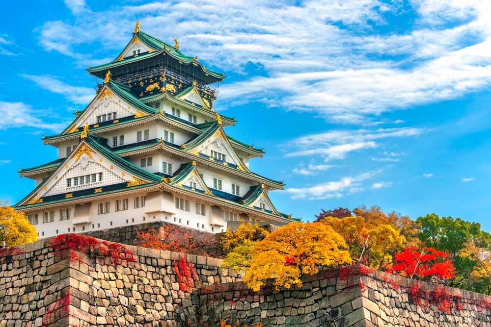 Osaka Castle in Osaka with autumn leaves