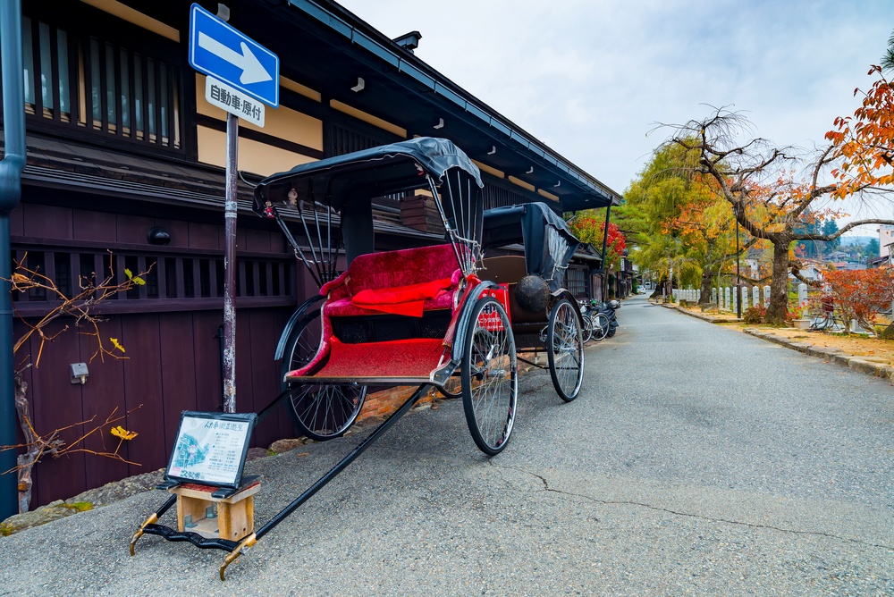Japanese rickshaw or old style two wheeled passenger cart in Takayama world heritage site