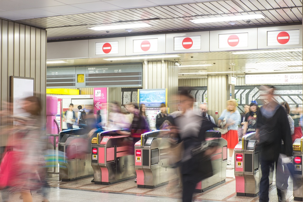Blurred abstract background of many people at subway station in Tokyo